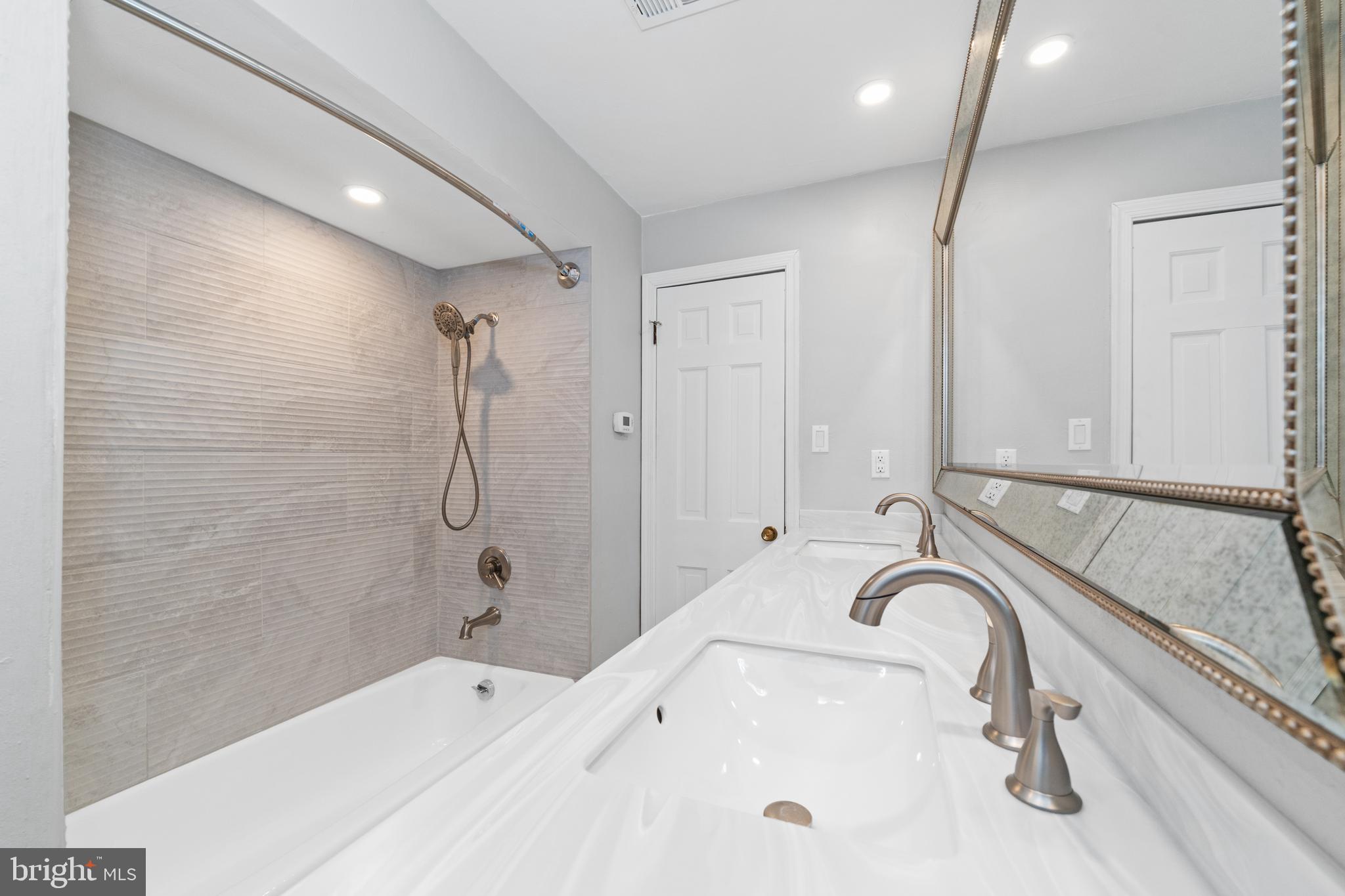 243 Heyburn Road Chadds Ford, PA 19317 - Photo 40 of 58 a bathroom with a tub and a shower