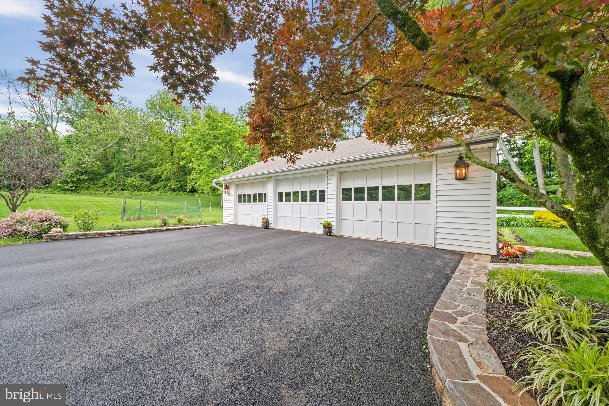 243 Heyburn Road Chadds Ford, PA 19317 - Photo 4 of 58 a view of a house with a yard and potted plants