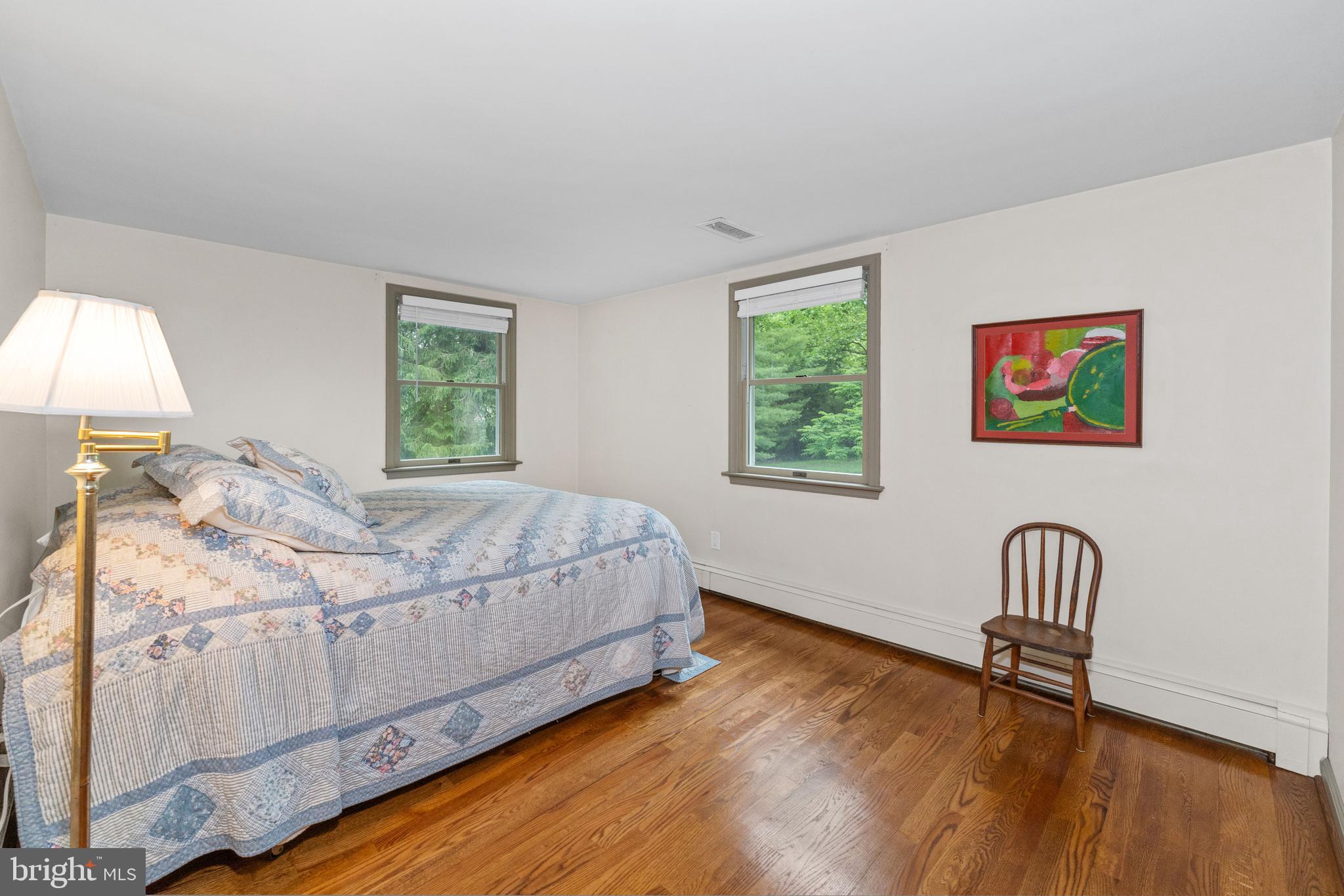 243 Heyburn Road Chadds Ford, PA 19317 - Photo 41 of 58 a bedroom with a bed and a chair