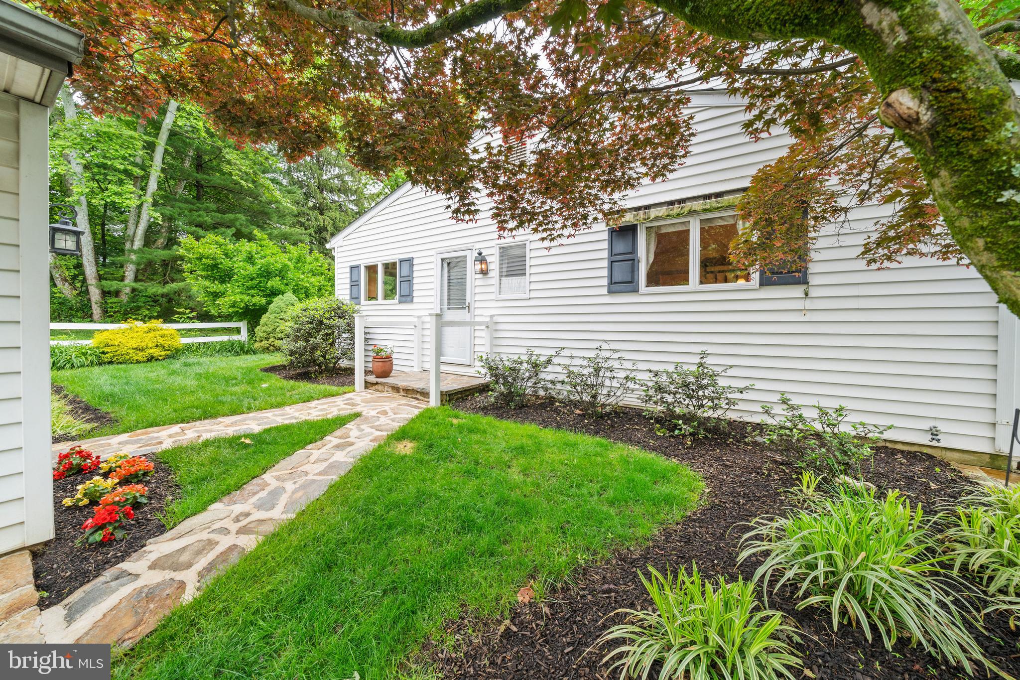 243 Heyburn Road Chadds Ford, PA 19317 - Photo 5 of 58 a front view of a house with a yard