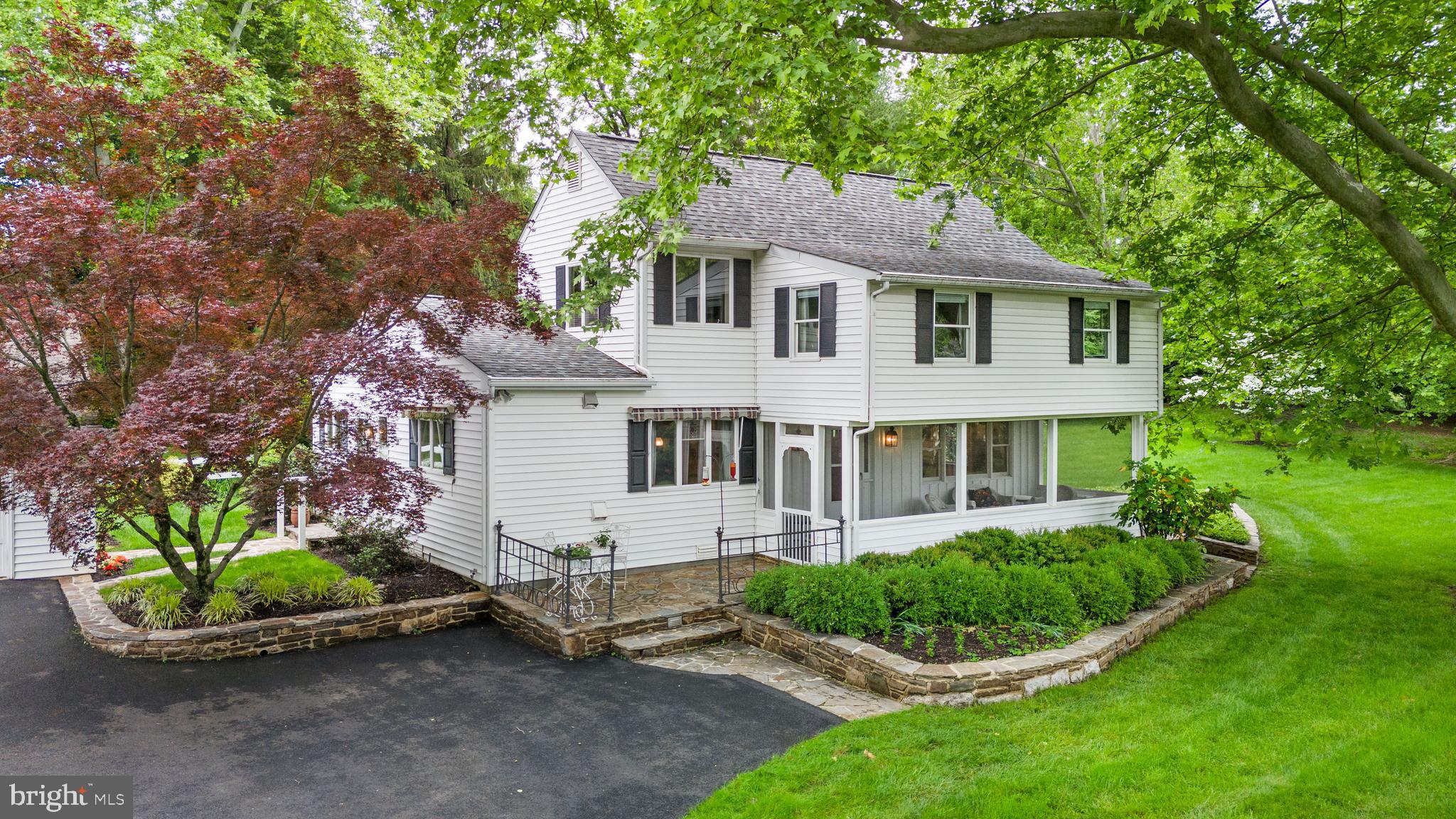 243 Heyburn Road Chadds Ford, PA 19317 - Photo 6 of 58 a front view of a house with a garden and plants