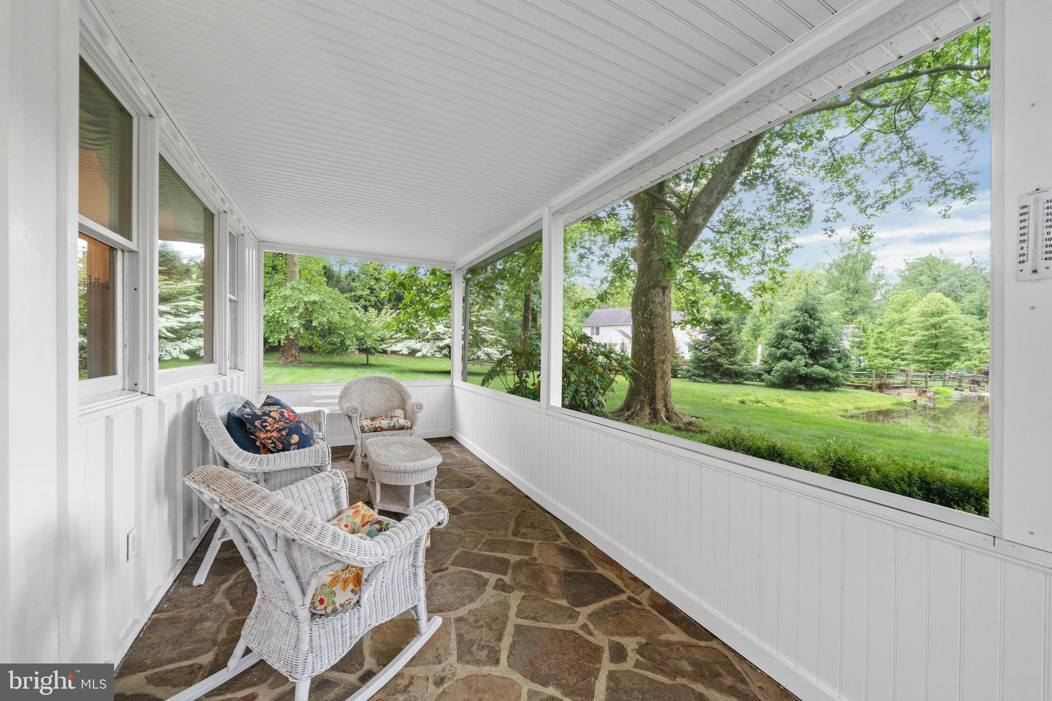 243 Heyburn Road Chadds Ford, PA 19317 - Photo 10 of 58 a living room with patio furniture and garden