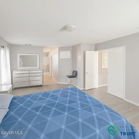 a bathroom with a toilet and a shower curtain