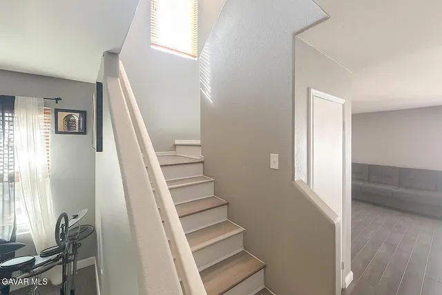 a bathroom with a shower and a sink