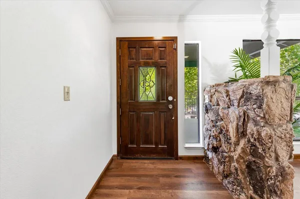 a view of entryway with wooden floor