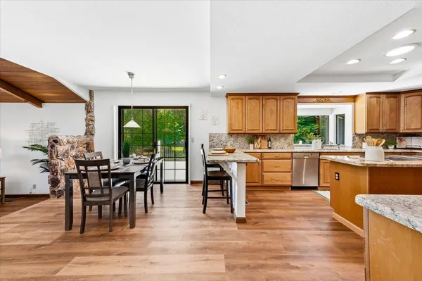 a kitchen with lots of counter top space and dining table