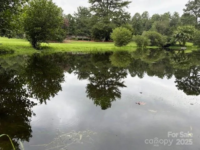 a view of lake with green space