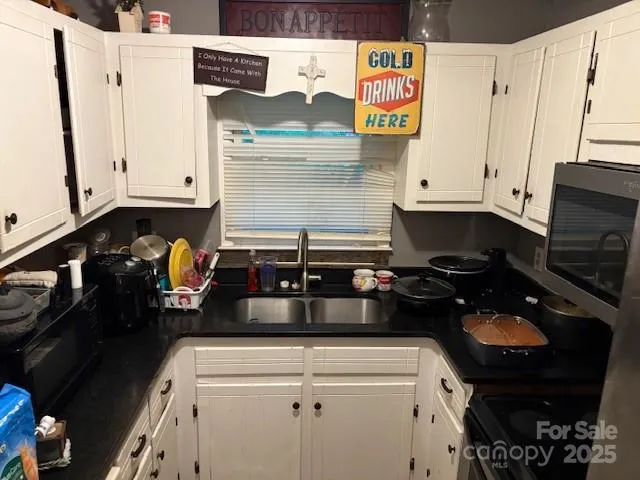 a kitchen with a stove and a refrigerator