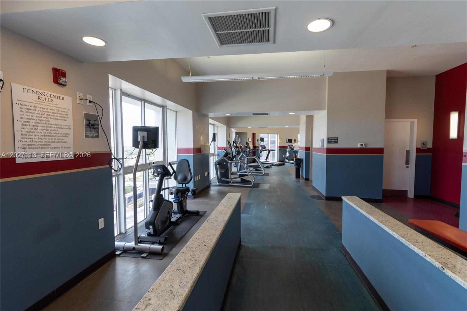 7275 Southwest 90th Way, Unit 213 Miami, FL 33156 - Photo 31 of 31 a view of a room with gym equipment