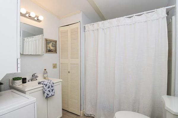21 Grove Street-onset Wareham Ma Onset, MA 02558 - Photo 14 of 15 a bathroom with a sink a toilet and shower curtain