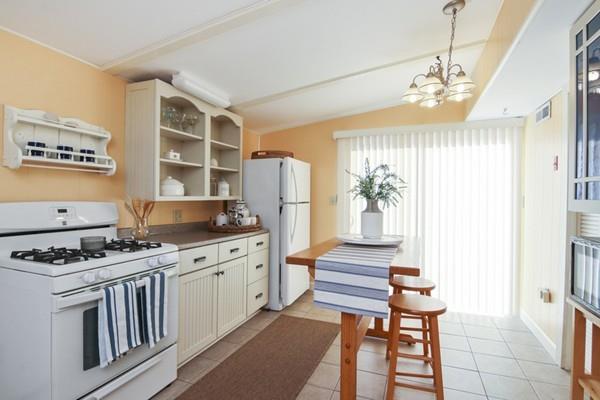 21 Grove Street-onset Wareham Ma Onset, MA 02558 - Photo 6 of 15 a kitchen with stainless steel appliances granite countertop a stove and a refrigerator
