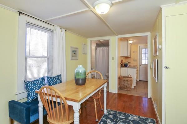 21 Grove Street-onset Wareham Ma Onset, MA 02558 - Photo 7 of 15 a view of kitchen island with furniture and wooden floor