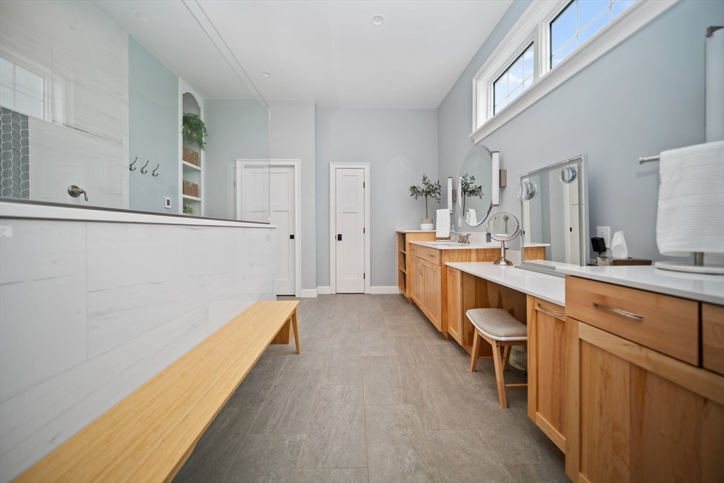 17 Chestnut Lane Littleton, MA 01460 - Photo 20 of 40 a spacious bathroom with a sink and a mirror