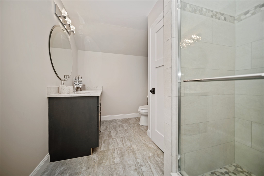 17 Chestnut Lane Littleton, MA 01460 - Photo 24 of 40 a bathroom with a sink a toilet and shower