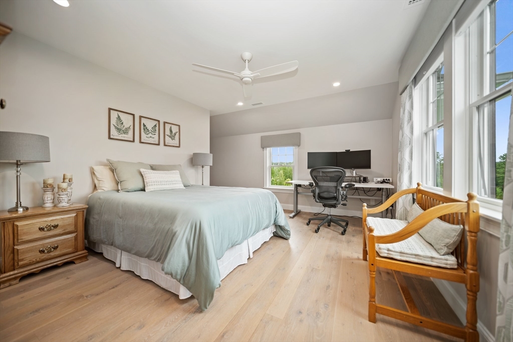 17 Chestnut Lane Littleton, MA 01460 - Photo 25 of 40 a bedroom with furniture and a flat screen tv