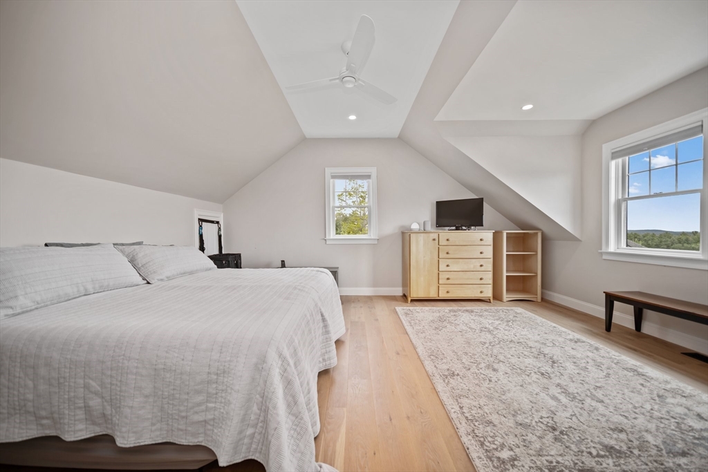 17 Chestnut Lane Littleton, MA 01460 - Photo 29 of 40 a spacious bedroom with a bed closet and a window