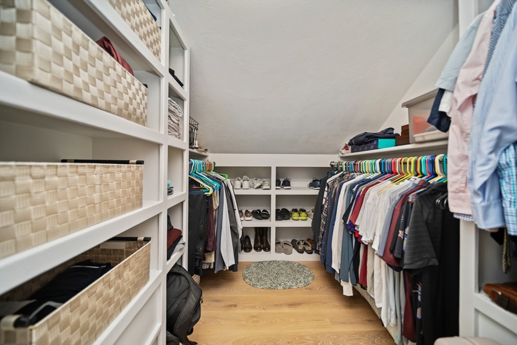 17 Chestnut Lane Littleton, MA 01460 - Photo 31 of 40 a view of walk in closet with clothes and shoes