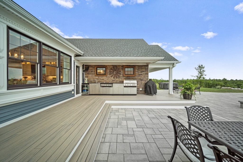 17 Chestnut Lane Littleton, MA 01460 - Photo 36 of 40 a view of a house with backyard sitting area and garden