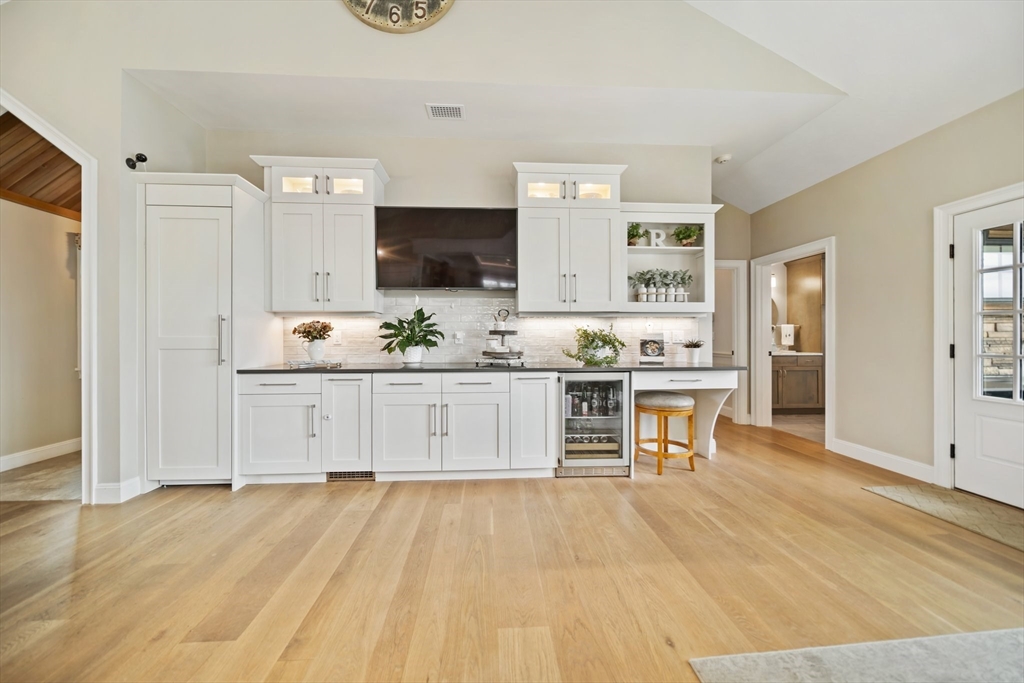 17 Chestnut Lane Littleton, MA 01460 - Photo 8 of 40 a kitchen with stainless steel appliances kitchen island sink refrigerator and cabinets