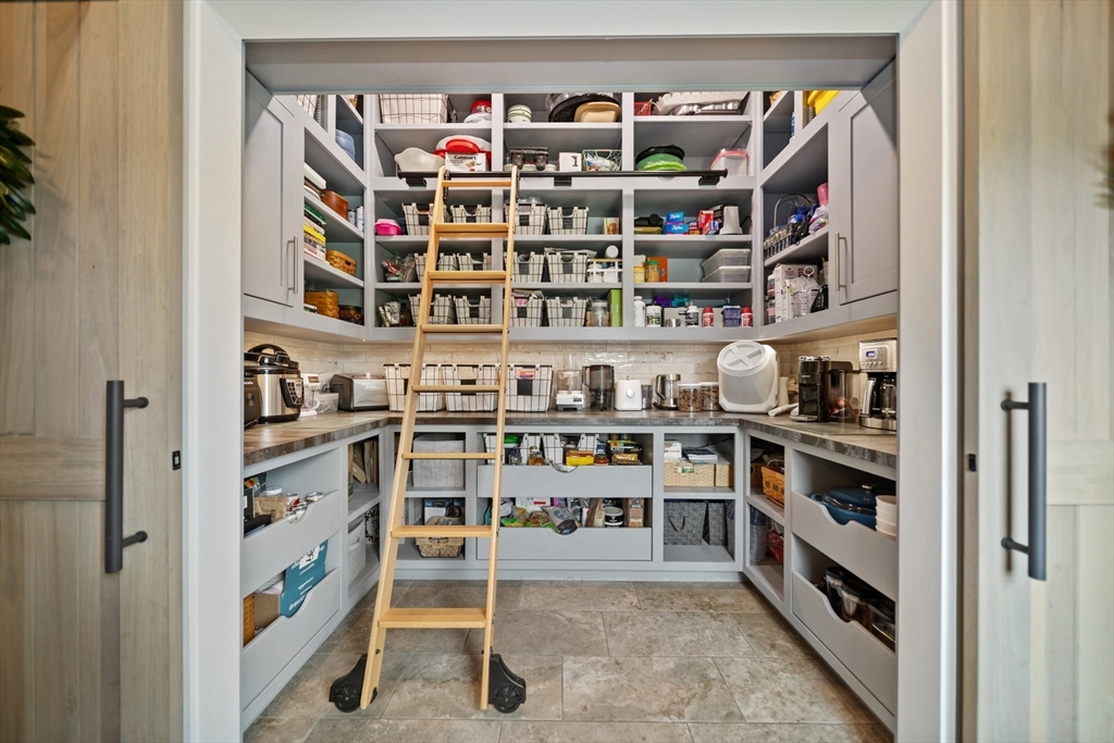 17 Chestnut Lane Littleton, MA 01460 - Photo 10 of 40 a view of walk in closet with clothes and shoes