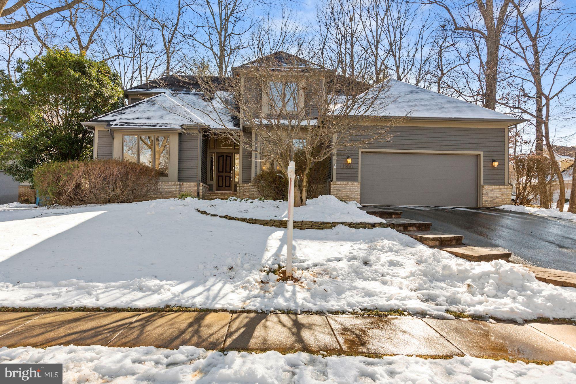 Gorgeous home on low beautiful wooded lot!