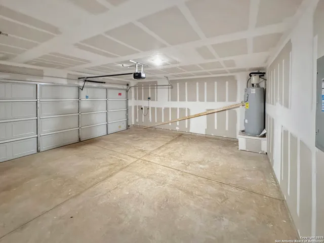 a view of an empty room with white walls