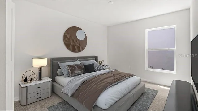 a bedroom with bed and a window