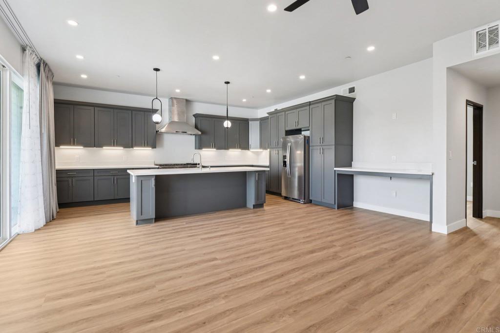 139-41 Almond Street Fallbrook, CA 92028 - Photo 12 of 35 a view of kitchen with wooden floor