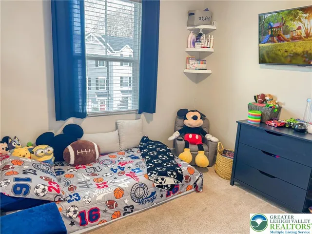 a bedroom with toys and dresser