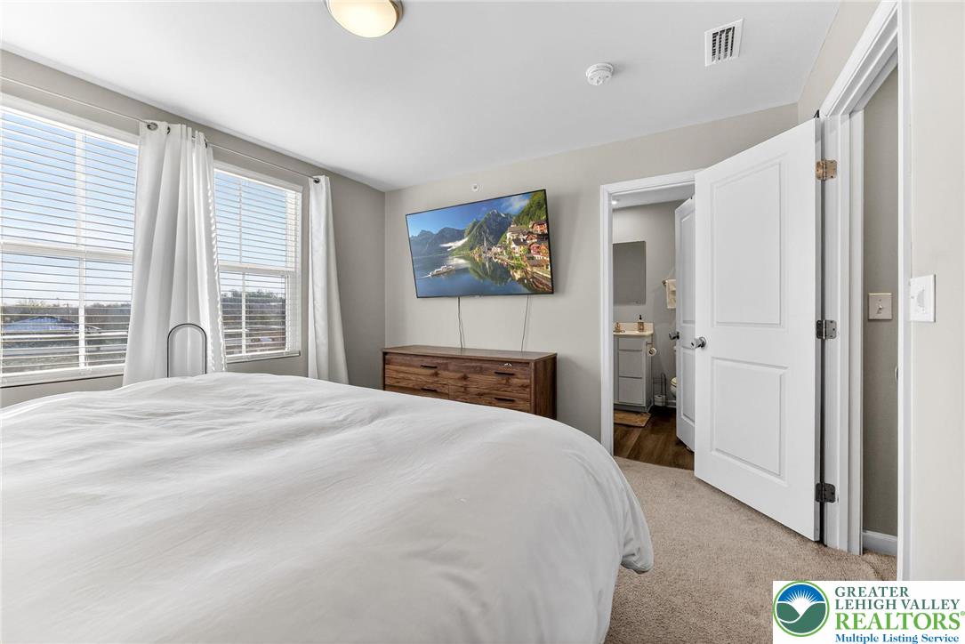 2132 Cross Country Road Northampton, PA 18067 - Photo 12 of 24 a bedroom with a bed and a painting on the wall