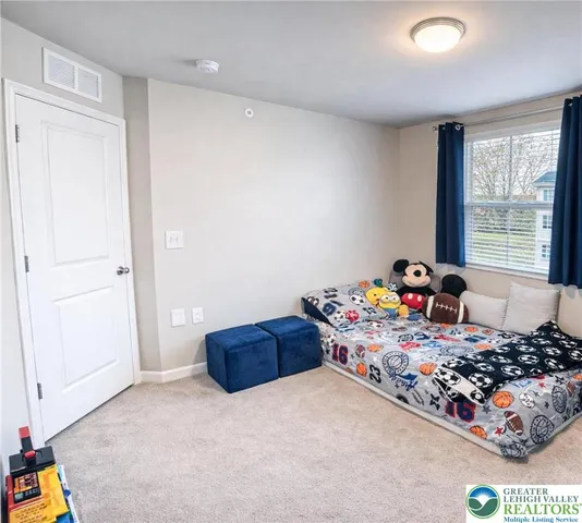 a bed room with a bed and a window