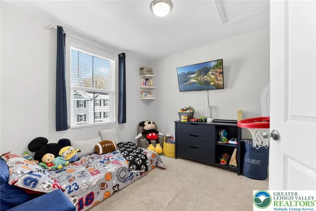 a bed room with a bed and a window