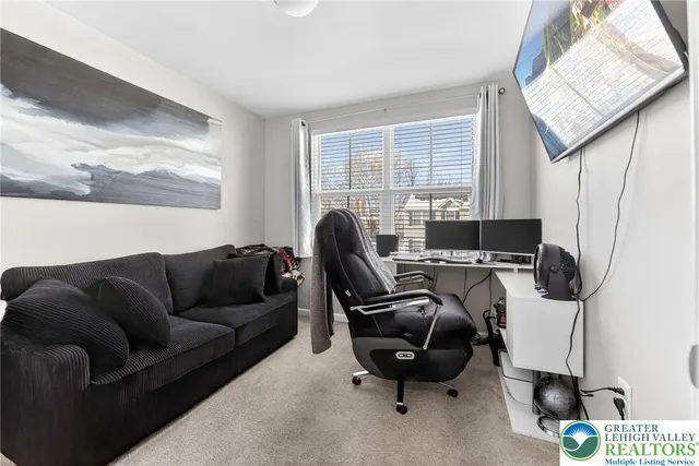 a work room with furniture and a window