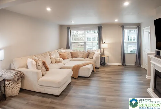 a living room with furniture and a large window