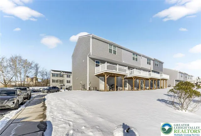 a front view of a building with parking