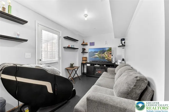 a living room with furniture and a chair