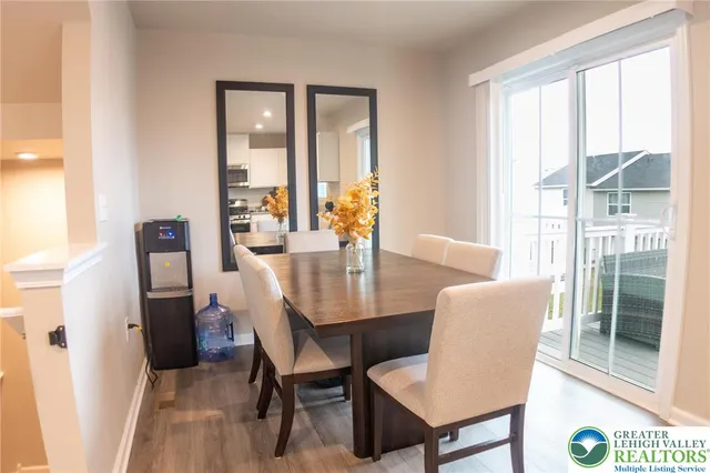 a dining room with furniture and window
