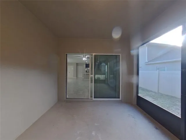 wooden floor and window in an empty room