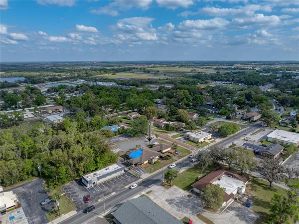 an aerial view of a houses with outdoor space