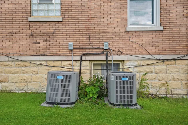 a view of house with yard and green space