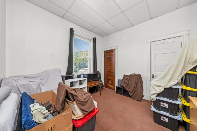 a room with furniture and a dresser