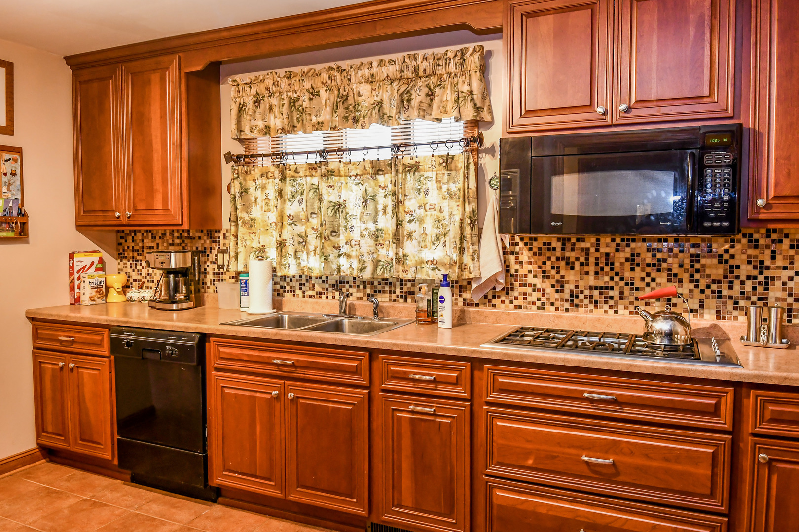 731 Spring Road Elmhurst, IL 60126 - Photo 6 of 23 a kitchen with stainless steel appliances granite countertop a sink and a microwave