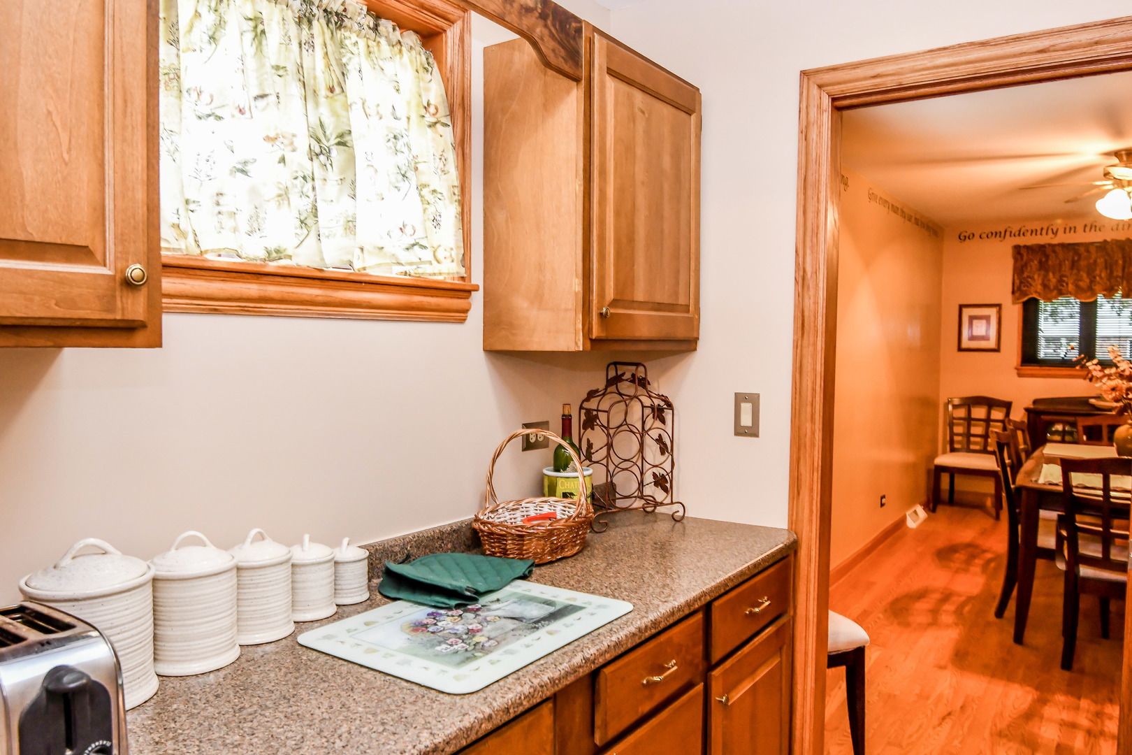 731 Spring Road Elmhurst, IL 60126 - Photo 9 of 23 a view of a kitchen area with furniture and wooden floor