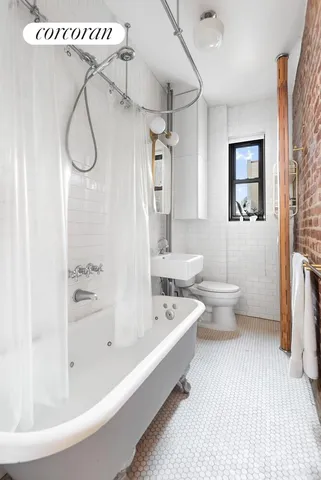 a living room with fish tank and a bookshelf