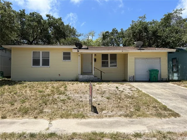 a house with trees in the background