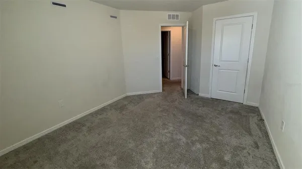 an empty room with closet area