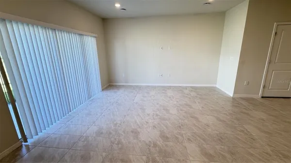 an empty room with wooden floor