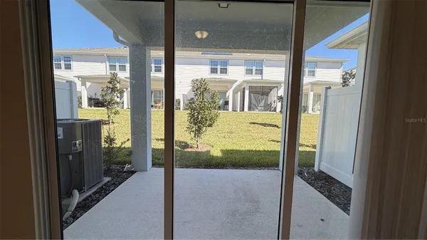 a view of a glass door and the balcony