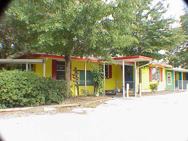 4371 Losco Road Jacksonville, FL 32257 - Photo 1 of 1 a front view of a house with a garden