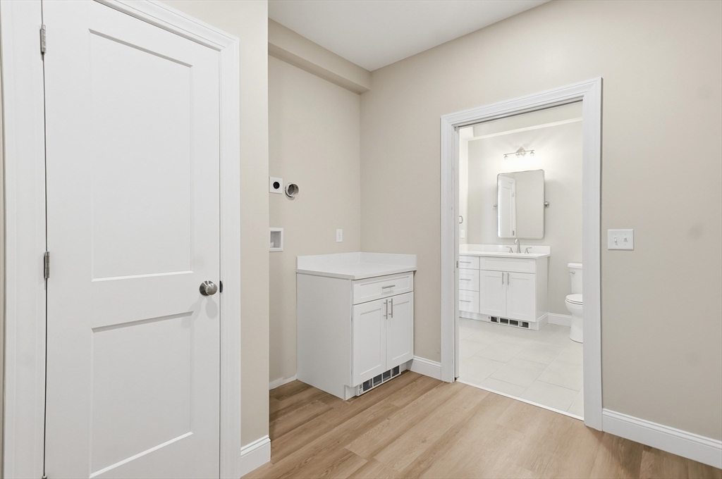 8 Vine Street, Unit 2 Haverhill, MA 01830 - Photo 13 of 20 a bathroom with a sink toilet and shower